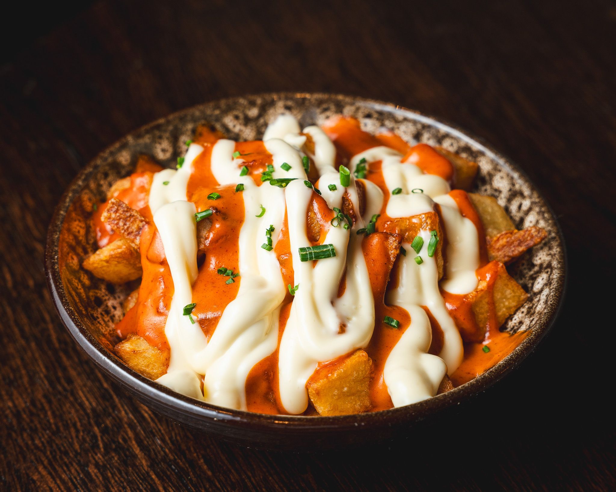 Crisp patatas bravas with smoky tomato sauce