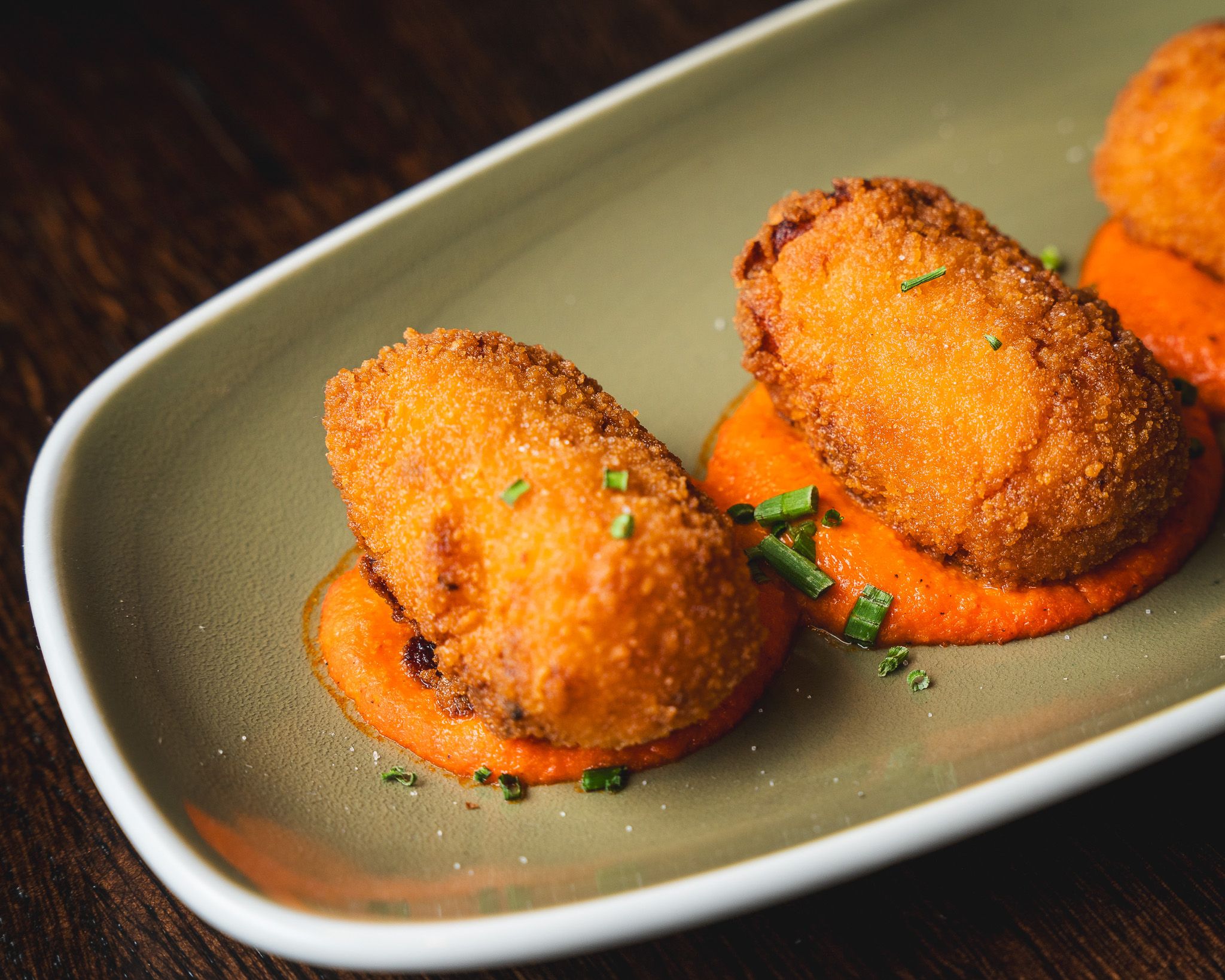 Golden croquettes plated for sharing