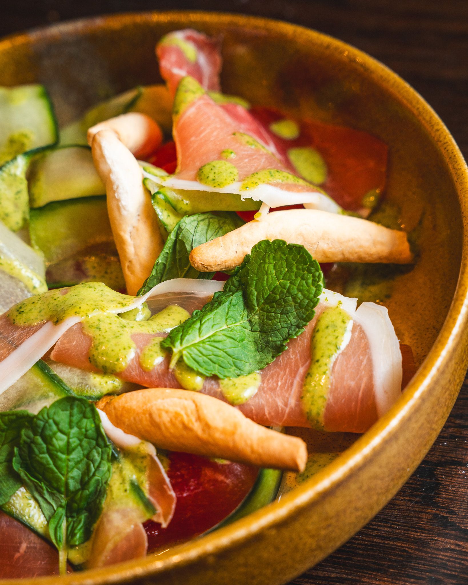 Serrano ham salad with fresh leaves and tomato