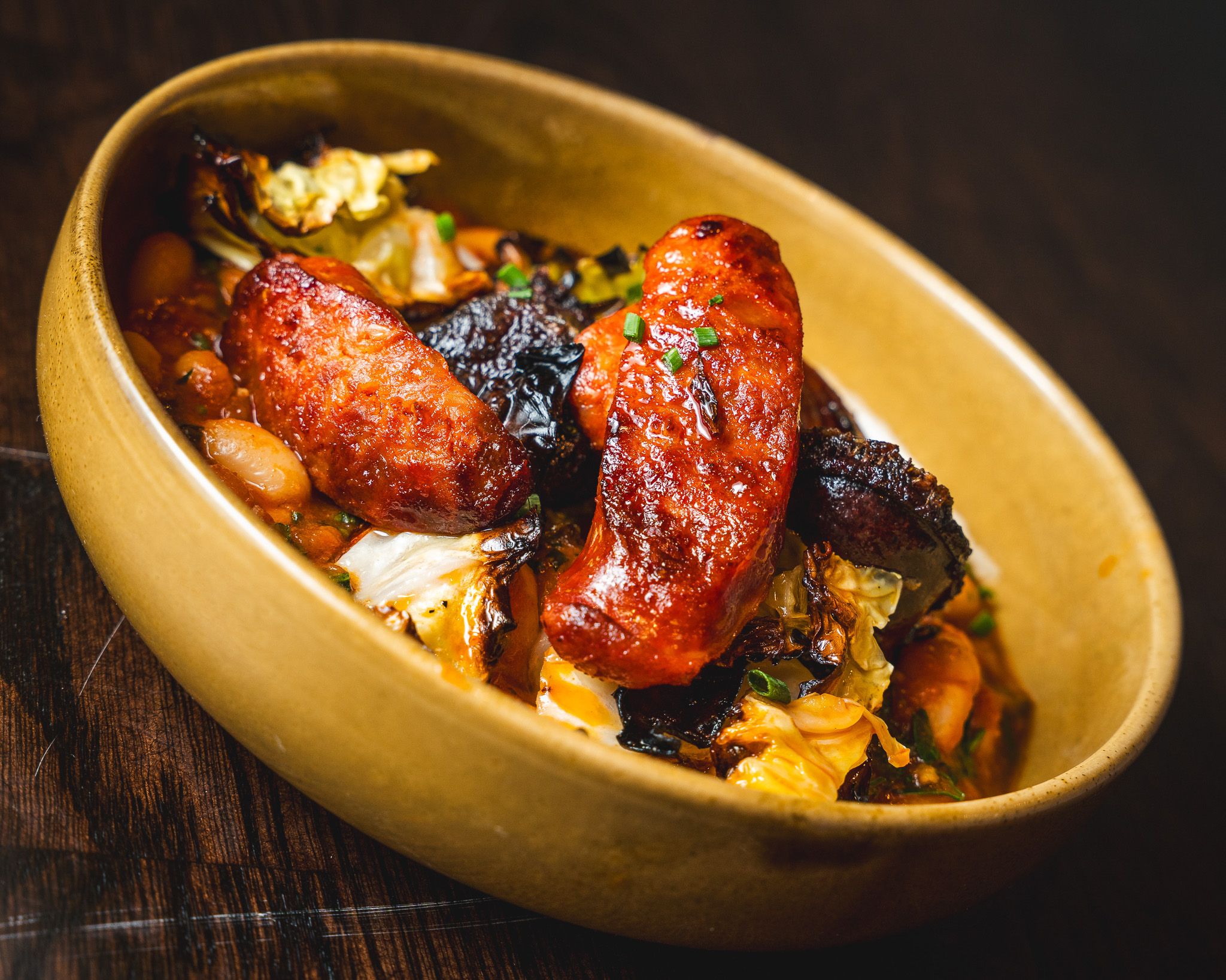 Chorizo pieces in a rustic serving bowl
